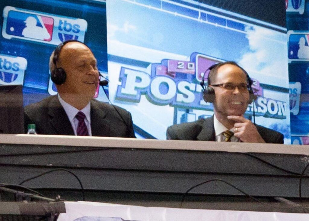 Archive photo from 2012: TBS broadcasters Cal Ripken Jr. and Ernie Johnson Jr. Keith Allison, CC BY-SA 2.0, cropped.