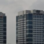 Archive photograph of Hyundai Motor headquarters at right and Kia headquarters at left in Seoul in 2010; not an image from the current earnings announcement.