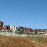 Archive containers at Haifa port, May 2011. Hanay, CC BY-SA 3.0 (cropped; image adaptation under the same license).