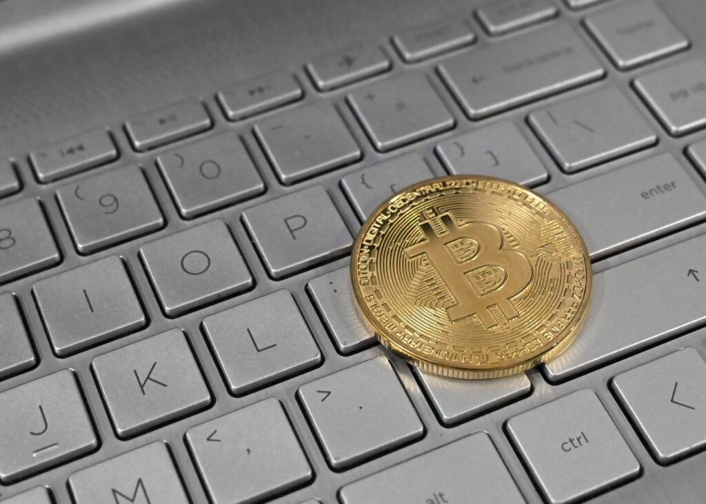 Archive photo: a physical bitcoin token rests on a laptop keyboard