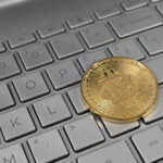 Archive photo: a physical bitcoin token rests on a laptop keyboard
