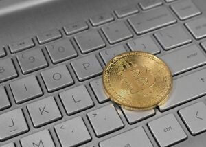 Archive photo: a physical bitcoin token rests on a laptop keyboard