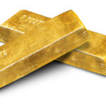 Archive photo: gold ingots stacked on a white background