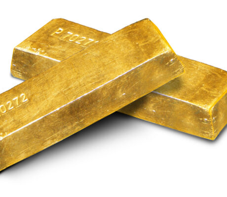 Archive photo: gold ingots stacked on a white background
