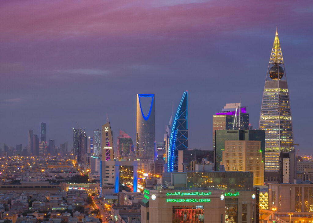 Archive photo: the Riyadh skyline at dusk, with the Kingdom Centre tower illuminated