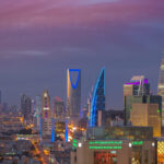 Archive photo: the Riyadh skyline at dusk, with the Kingdom Centre tower illuminated
