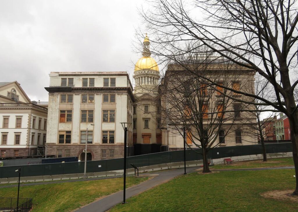 Archive photo: New Jersey State House in Trenton, March 31, 2019. Ken Lund, CC BY-SA 2.0, cropped. Not an enrollment office or current event.
