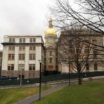 Archive photo: New Jersey State House in Trenton, March 31, 2019. Ken Lund, CC BY-SA 2.0, cropped. Not an enrollment office or current event.