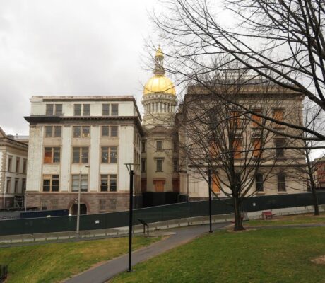 Archive photo: New Jersey State House in Trenton, March 31, 2019. Ken Lund, CC BY-SA 2.0, cropped. Not an enrollment office or current event.