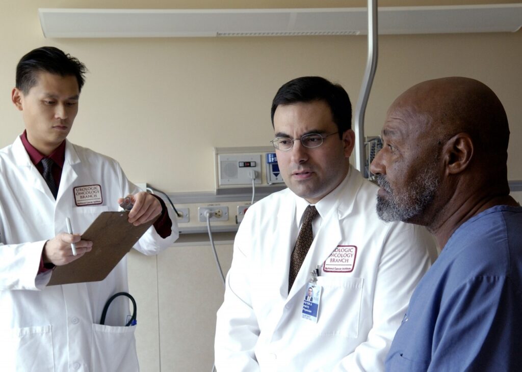 Doctors consult with a patient in a National Cancer Institute archive photograph from 2005. Illustrative image, not an assessment of the people pictured.