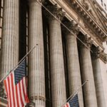 TheNewYorkStockExchange colonnade andAmericanflags in an illustrative archive photograph,notFridaytrading.