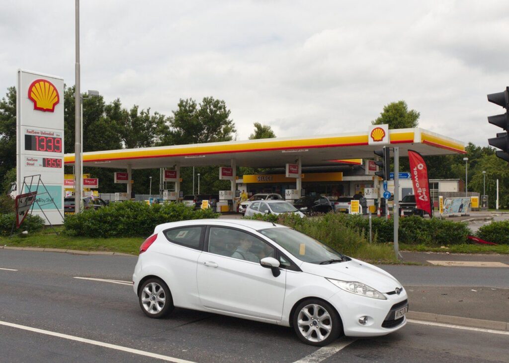 Archive photograph of a Shell petrol station in Haydock, England, in July 2021; prices shown are historical, not current fuel prices.