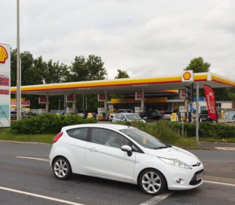 Archive photograph of a Shell petrol station in Haydock, England, in July 2021; prices shown are historical, not current fuel prices.