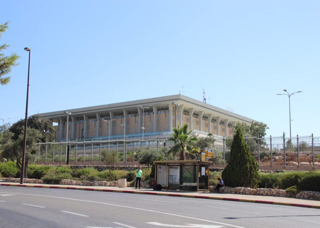 Archive photo: the Knesset building in Jerusalem, July 5, 2018, viewed from across the street. Gary Todd, CC0, cropped. Not the 2026 election or the investigation.