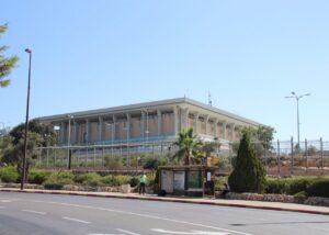 Archive photo: the Knesset building in Jerusalem, July 5, 2018, viewed from across the street. Gary Todd, CC0, cropped. Not the 2026 election or the investigation.