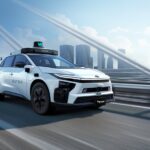 Toyota-supplied promotional image of a bZ4X fitted with Waymo autonomous-driving hardware.