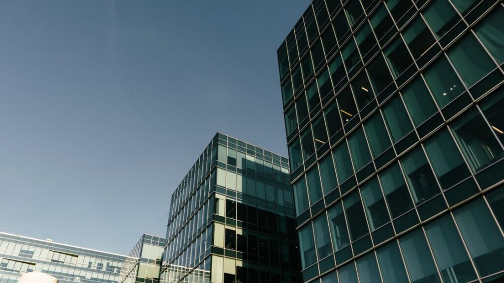 Glass office buildings in an illustrative archive photograph. No property is identified as a delinquent loan in the MBA survey.