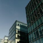 Glass office buildings in an illustrative archive photograph. No property is identified as a delinquent loan in the MBA survey.