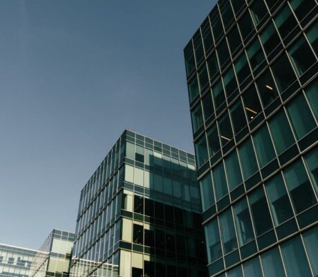 Glass office buildings in an illustrative archive photograph. No property is identified as a delinquent loan in the MBA survey.